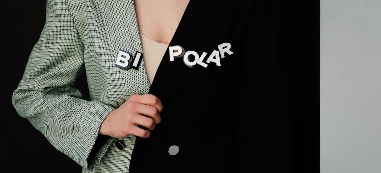 a woman with the word bipolar on her jacket