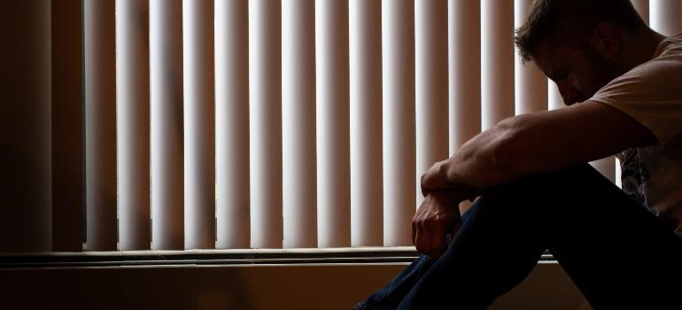 a man alone in a dark room recognizing emotional patterns in bipolar disorder